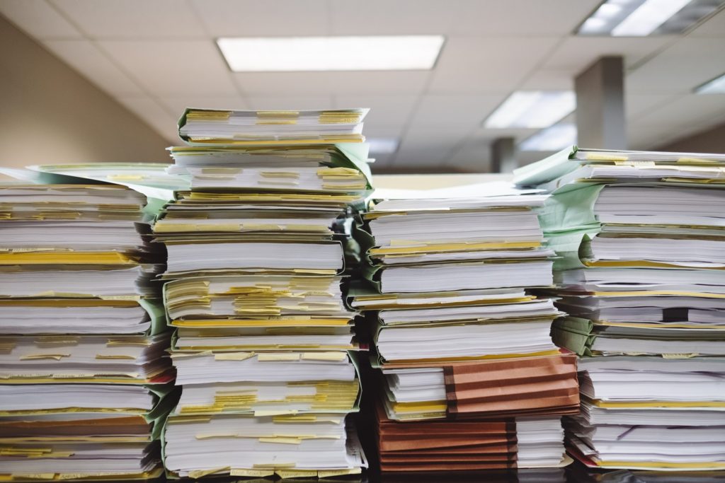 stack of paperwork on table